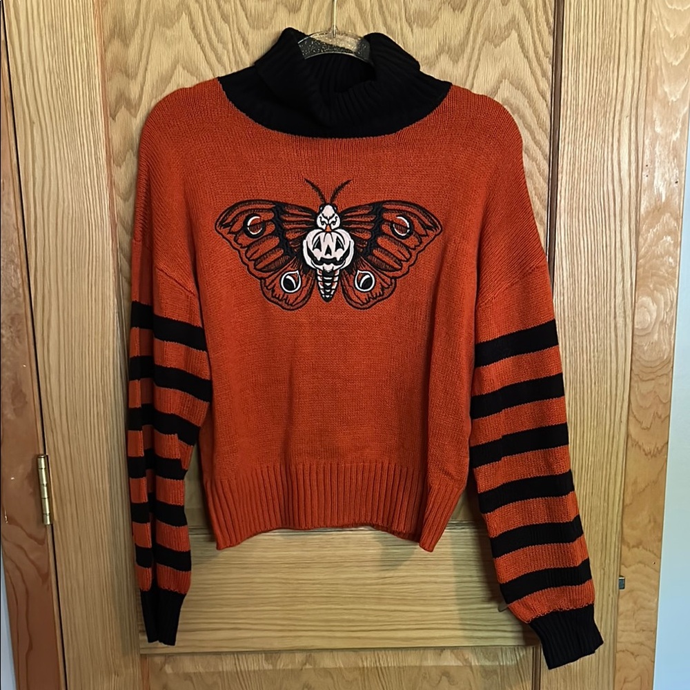 Orange and Black Turtleneck Sweater with Moth Design